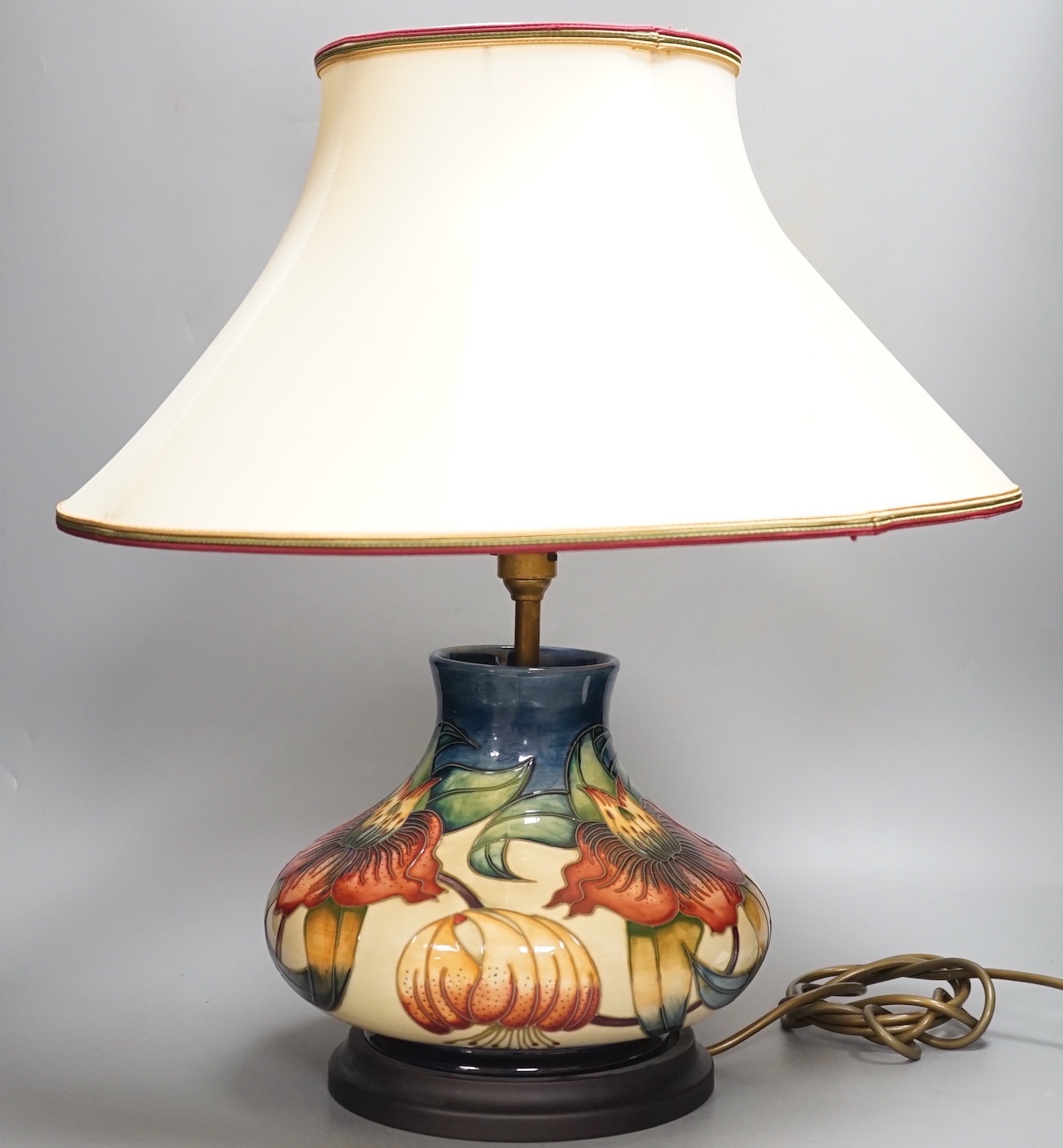 A Moorcroft Anna Lily pattern lamp base with shade